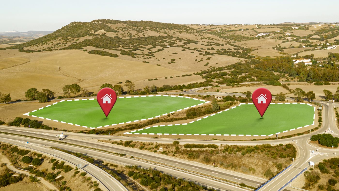 Aerial photo of a hillside development site beside a highway